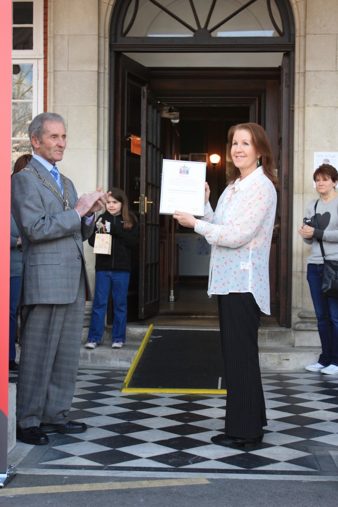 The Mayor  presents Shrewsbury House with a Commemorative Certificate representing the Royal Warrant recently issued to the Royal Borough