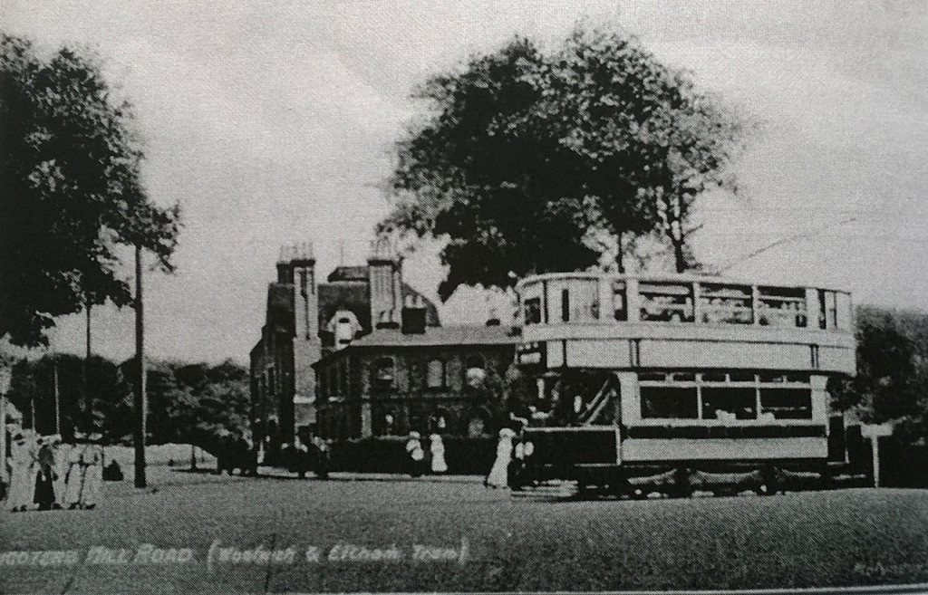 A 4 wheeled tram passes Shooters Hill Police Station from David Lloyd Bathe’s “Steeped in History”