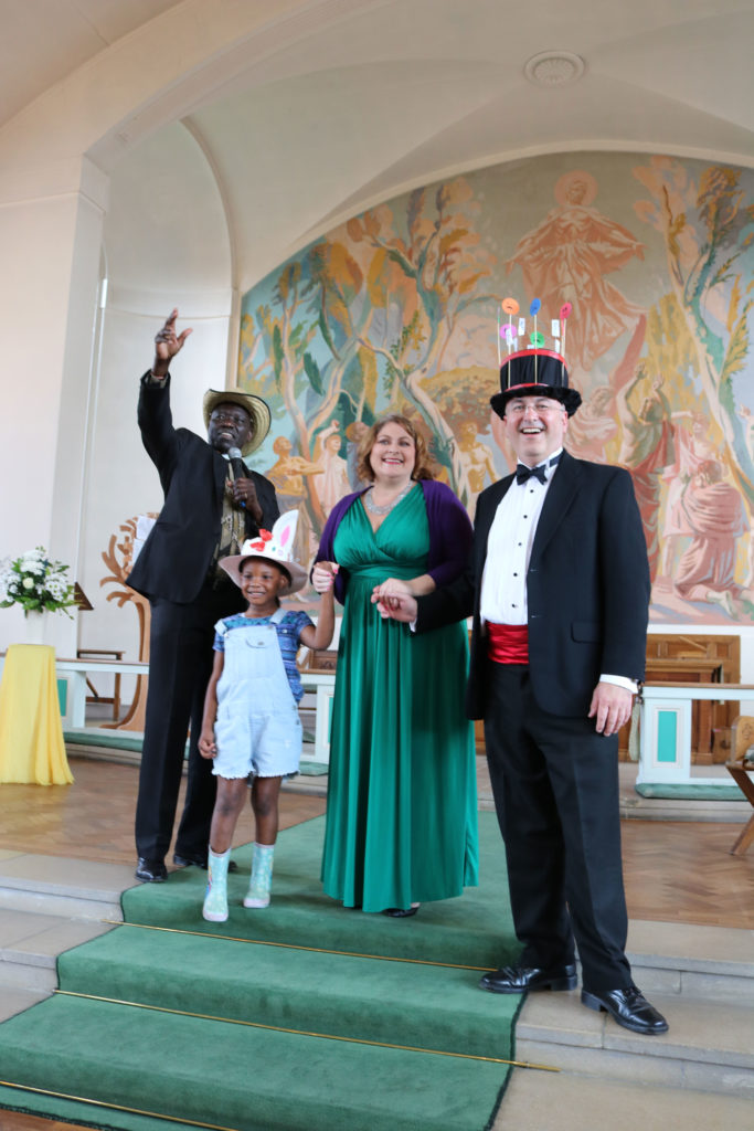 Sally Silver presenting the prizes for best hat at All Saints 150th Anniversary Concert